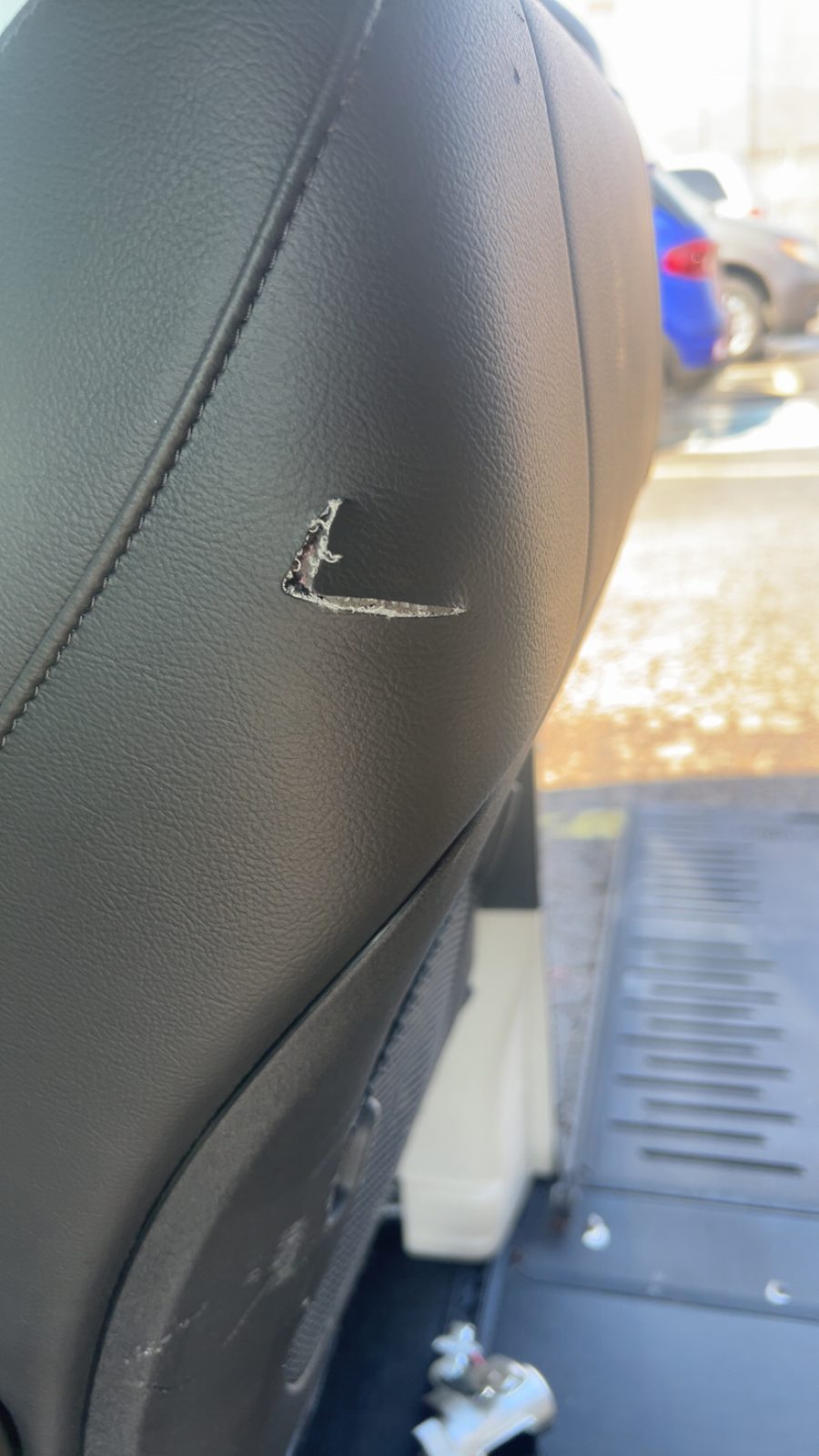 Torn seat side bolster before repair
