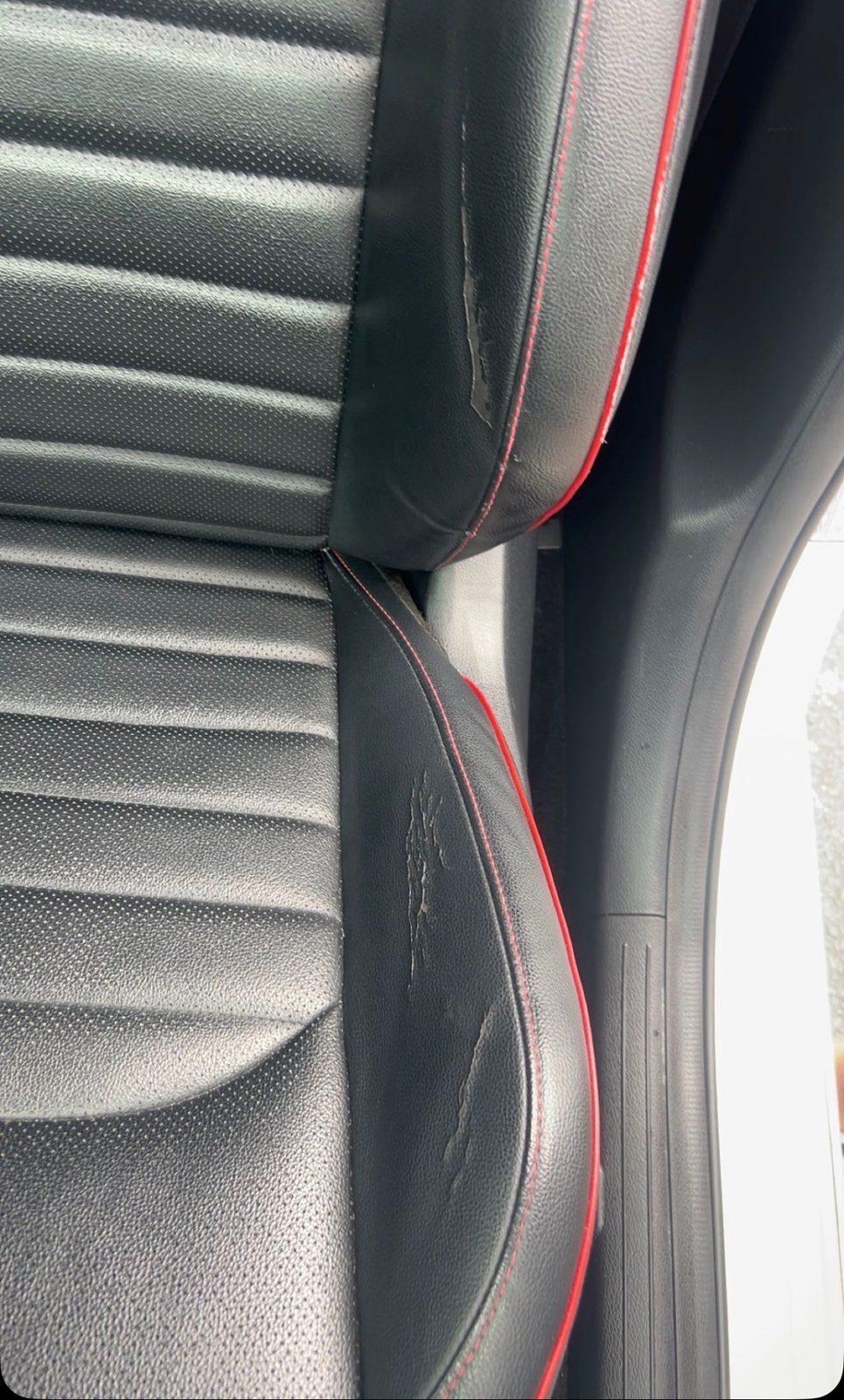 Torn seat bolster seam before repair